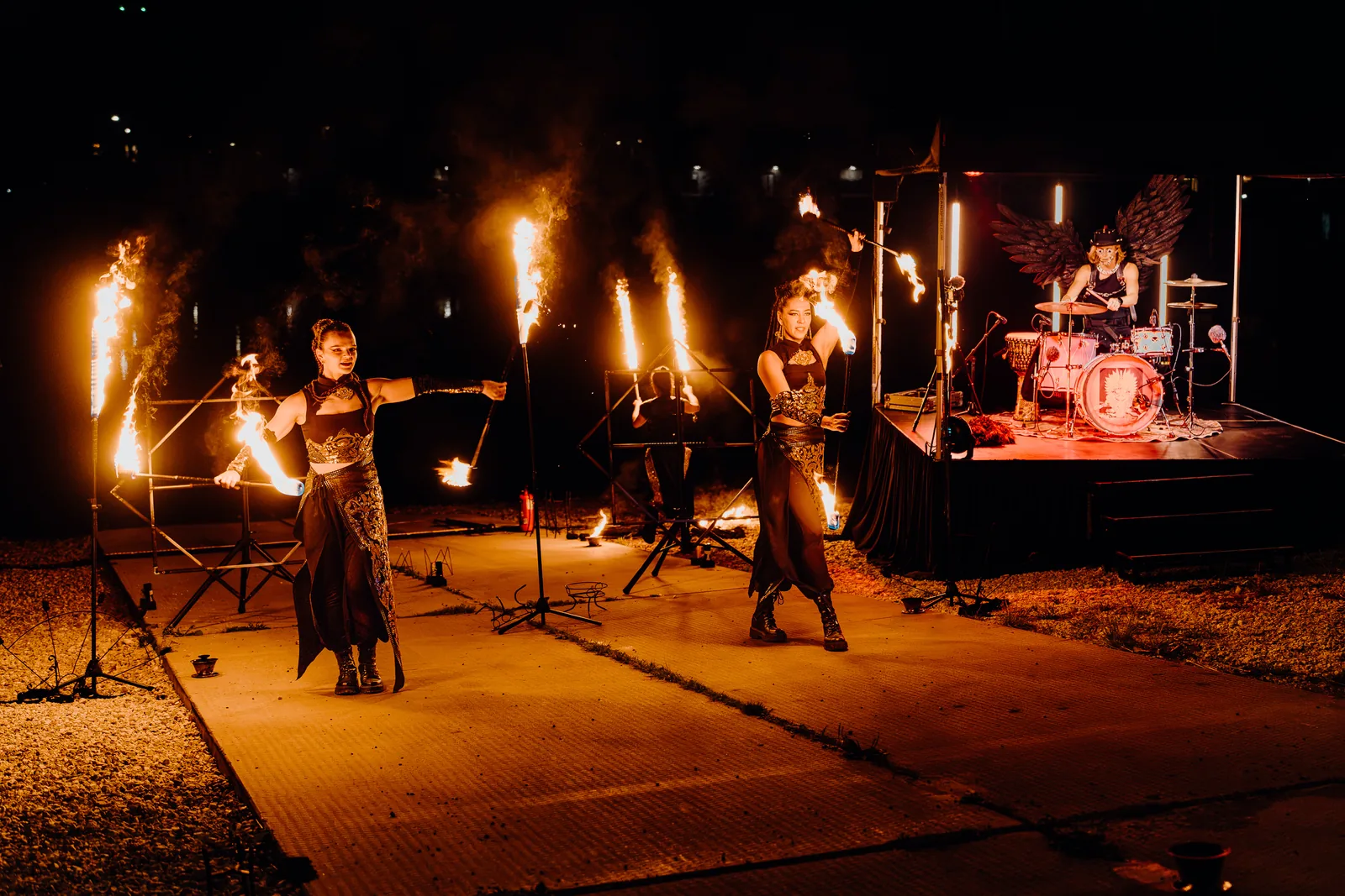 Fire dancers and drummer on stage at the Kaarsilla anniversary