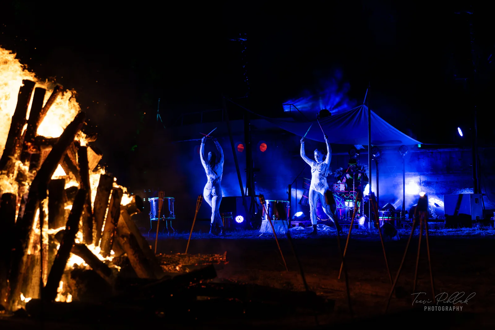 Bonfire and dancers in blue light in Ulge